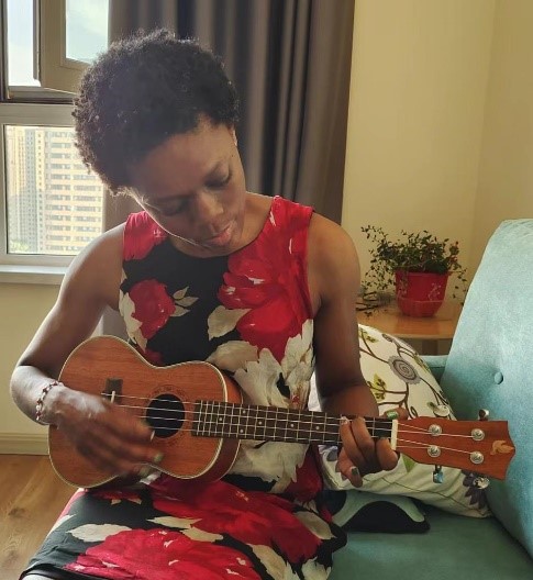 What a difference a strum makes! Showing off my skills to my friend.